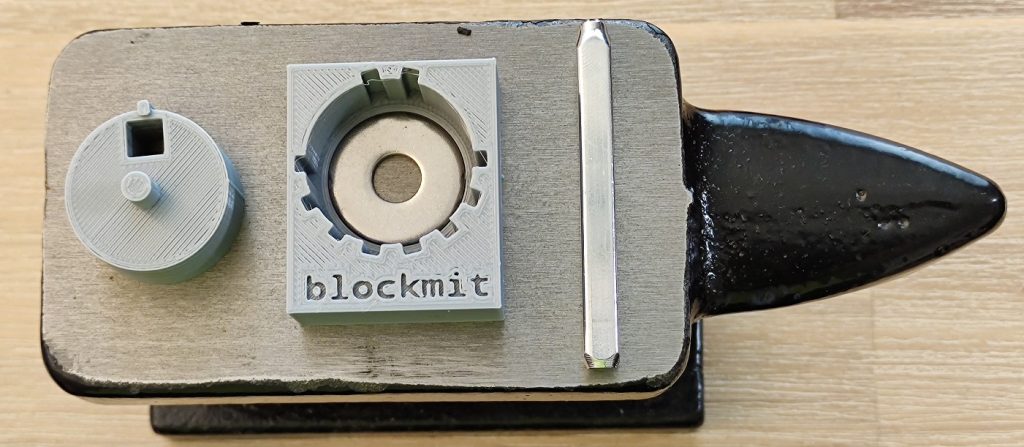 seed word backup and hardware wallet backup uncle Jim kit blockmit jig on anvil top view